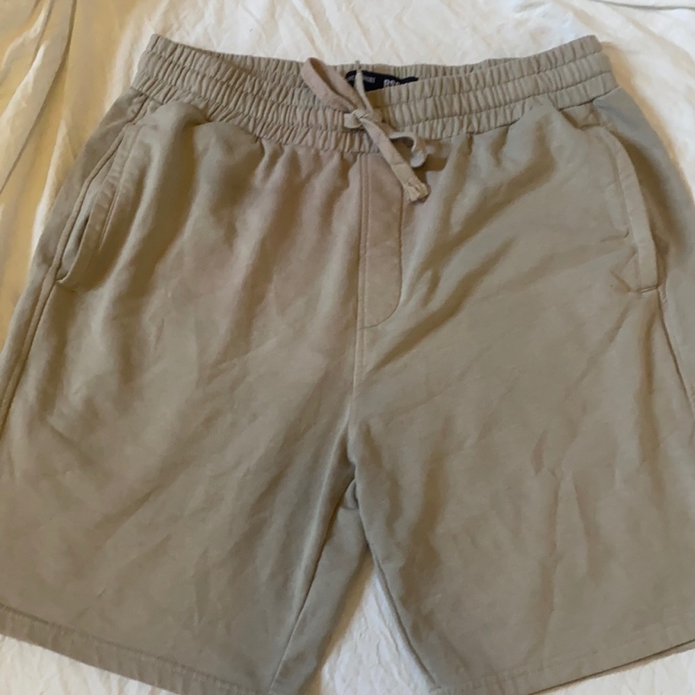 These are men tan sweat shorts from Tillys!